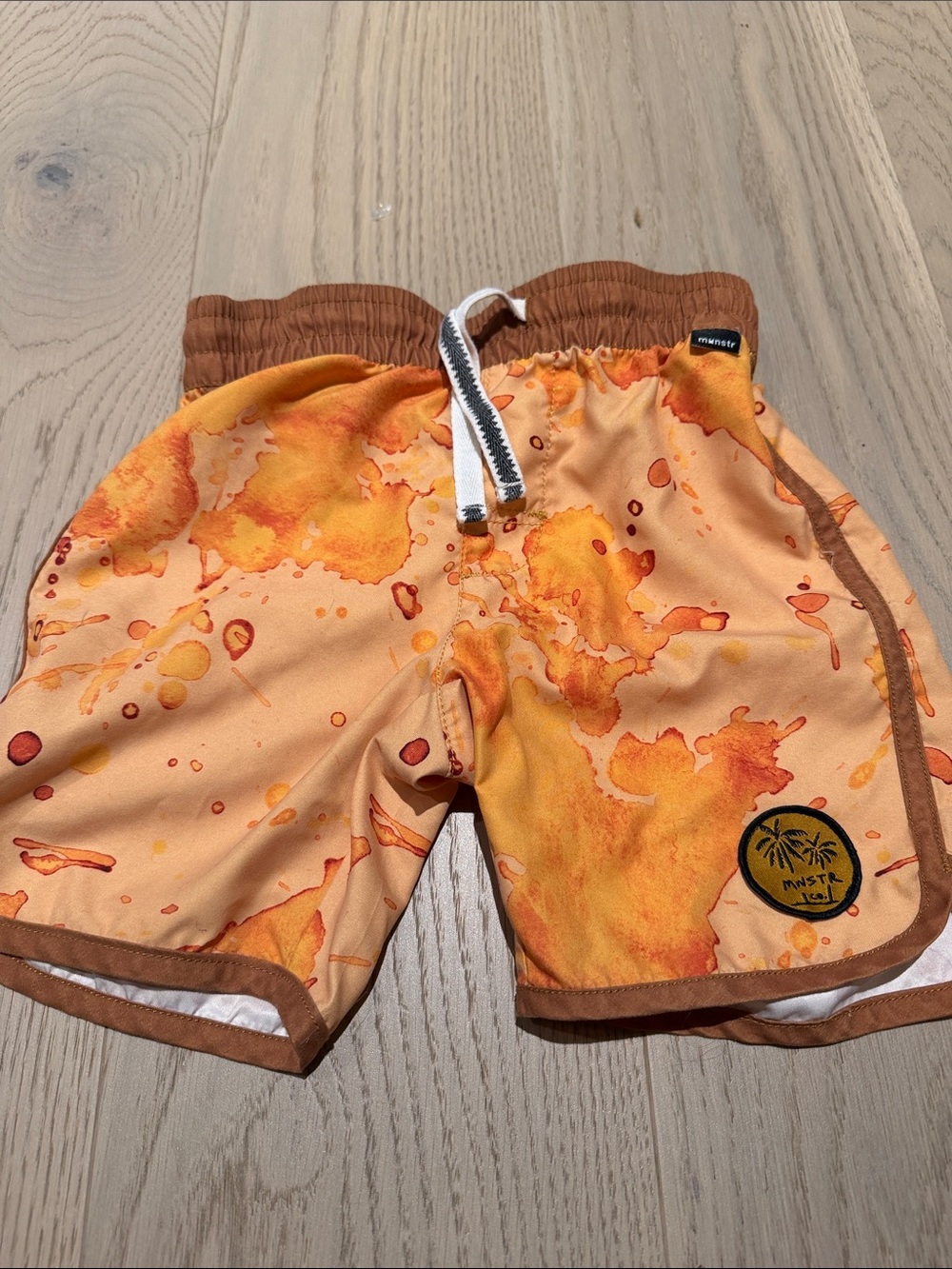 Kids Orange Splash Swim Trunks by Munster